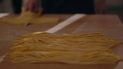 Cook Forces Equal Portions Of Spaghetti On Knife. Video stock 262668193