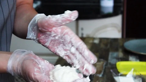 Cook forms cheesecakes before obvalivanie in flour Stock Footage 112508727