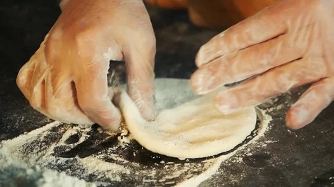 The Cook Forms The Dough By Hand And Places It On The Table Stock Footage 108205849
