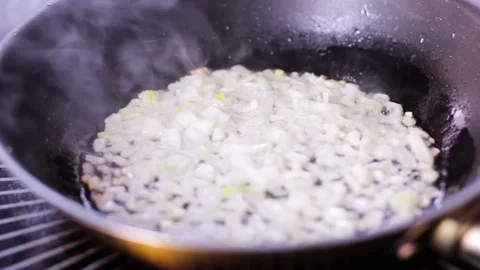 Cook fried onions in a pan Stock Footage 109471303