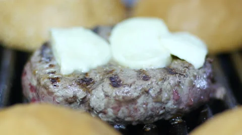 Cook fries hamburger meat on the grill sprinkled with cheese Stock Footage 59597698