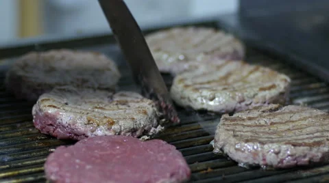 Cook fries hamburger meat on the grill Stock Footage 59598439