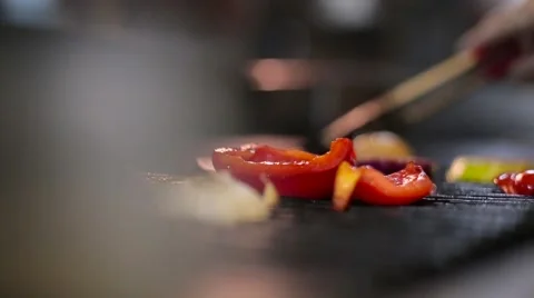 Cook fries vegetables on the grill Stock Footage 67862959