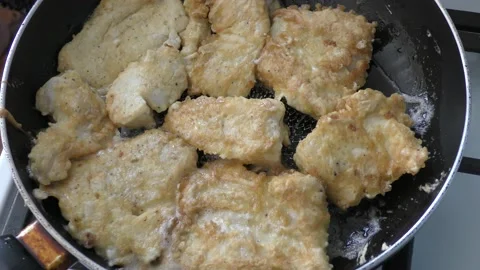 The cook fry the fish in a pan Stock Footage 166702211