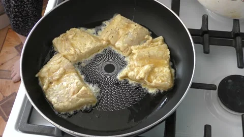 The cook fry the fish in a pan Stock Footage 166707975