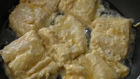 The cook fry the fish in a pan Stock Footage 166707988