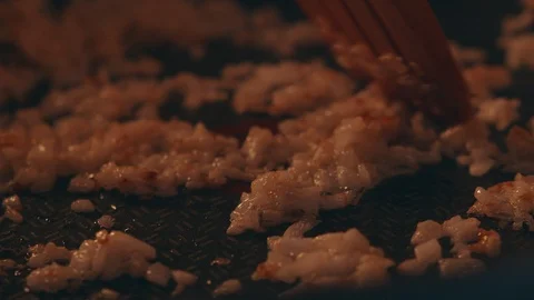 Cook frying onions in a pan Stock Footage 117940997