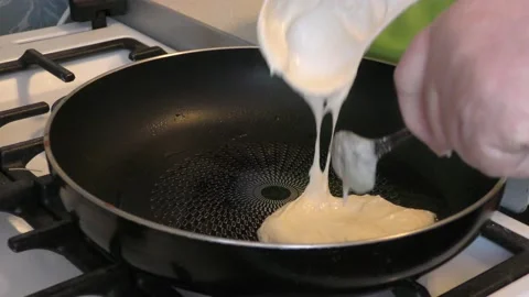 The cook is frying pancakes 스톡 동영상 148949987