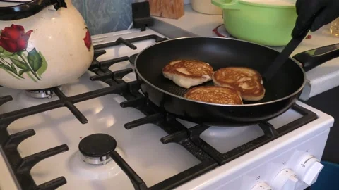 The cook is frying pancakes 動画素材 148950203