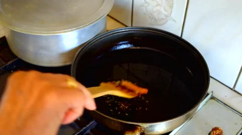 Cook frying spices in a pan Stock Footage 41533032