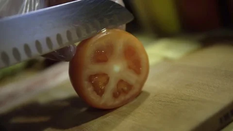 Cook with gloves on cut tomato 스톡 동영상 85326144