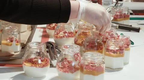 Cook in gloves preparing dessert Stock Footage 47583649