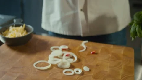 Cook in Gloves Throws Rings of Onion on Wooden Board. Concept Healthy Food Stock Footage 196256835