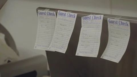 Cook graps order check for preparation Stock Footage 73886041