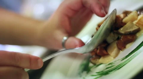 Cook hands preparing a gourmet dish with mushrooms Stock Footage 47210651
