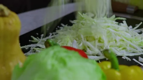 The cook has finished the Chinese cabbage and will now throw it into the salad Stock Footage 273013022