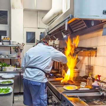 Cook In The Kitchen. Isolated Stock Photos