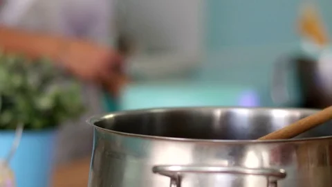 Cook is in the Kitchen Preparing a Cake Stock Footage 75590485