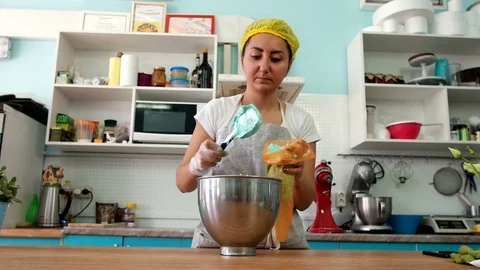 Cook in the Kitchen Preparing Cream Stock Footage 75588707