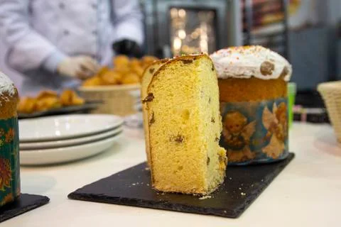 Cook in the kitchen preparing Easter cakes on the eve of the holiday Stock Photos