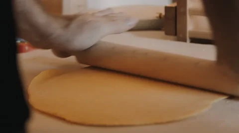 Cook kneading dough with rolling pin on table Stock Footage 41544581