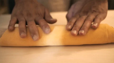 Cook kneading dough with rolling pin on table Stock Footage 41845828
