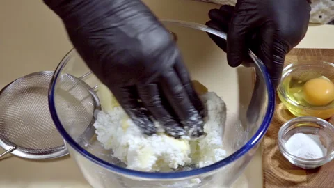A cook kneads cookie dough made from cottage cheese. Stock Footage 299635230