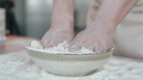 The cook kneads the dough. A professional baker prepares dough for bread. 스톡 동영상 297947341