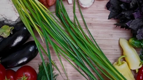 Cook lay aside two bunches of green onions Stock Footage 78056168