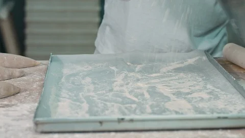 The cook lays the dough on a baking sheet Stock Footage 92581265