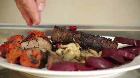 Cook lays meat dish Stock Footage 48169041