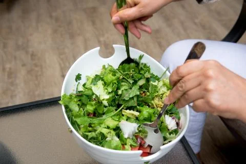 Cook make salad from greens Stock Photos