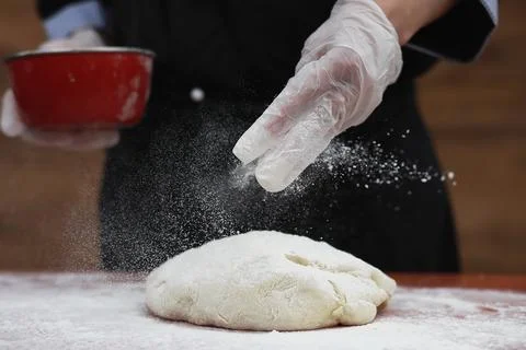 The cook makes flour for baking on the table Stock Photos