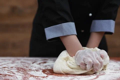 The cook makes flour for baking on the table Stock Photos
