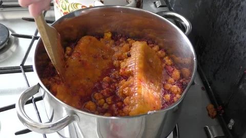 Cook makes jam from berries Stock Footage 136633149