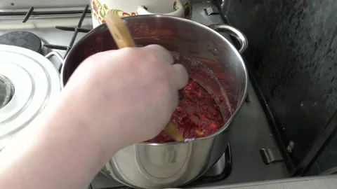 Cook makes jam from berries Stock Footage 136633717
