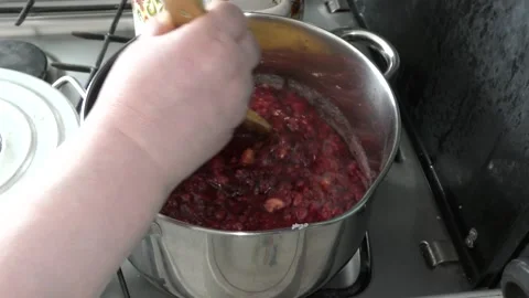Cook makes jam from berries Stock Footage 136633758