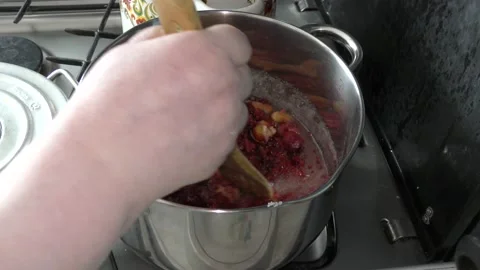Cook makes jam from berries Stock Footage 136633964