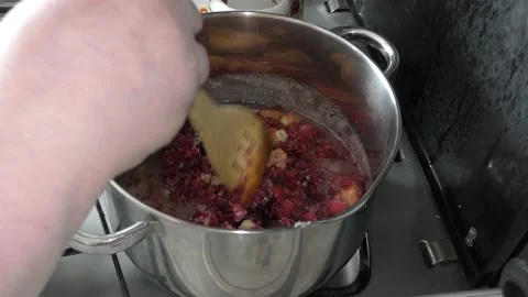 Cook makes jam from berries Stock Footage 136634118