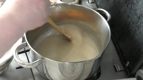 Cook makes jam from berries Stock Footage 136634274