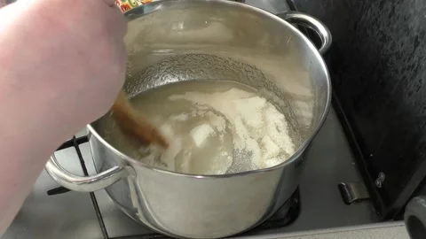 Cook makes jam from berries Stock Footage 136634464