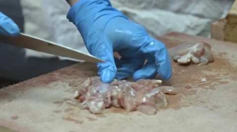 Cook makes pork chops by kitchen hammer Stock Footage 58854843