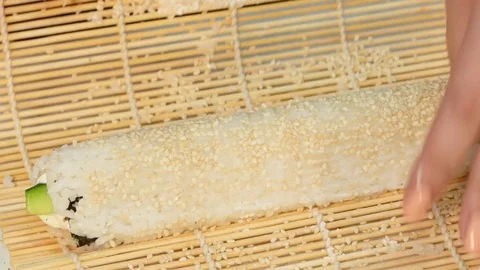 The cook makes a roll with rice outside. Video stock 85431469