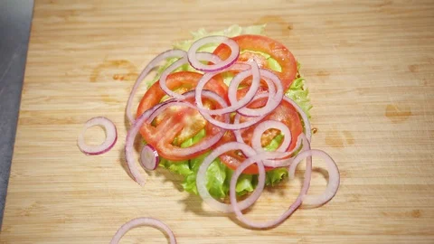 Cook makes a sandwich with vegetables Stock Footage 129685087
