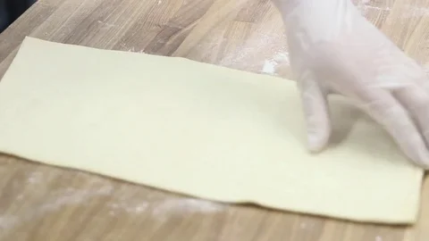 The cook makes the workpiece under the dough cake Vídeos de archivo 70004444