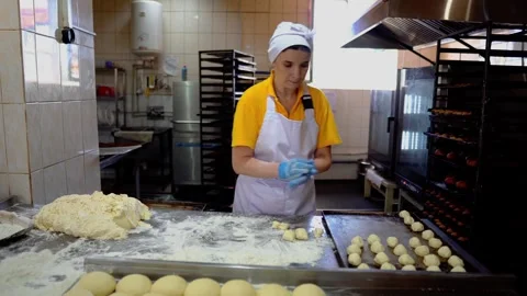 The cook is making baked goods in the kitchen Video stock 257255312