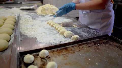 The cook is making baked goods in the kitchen Video stock 257255711