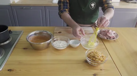 The cook is making marinade for kitchen legs Stock Footage 57606148