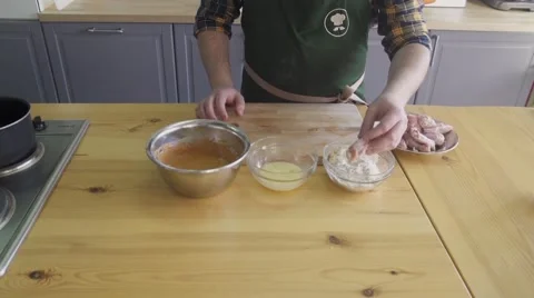The cook is making marinade for kitchen legs Stock Footage 57607052