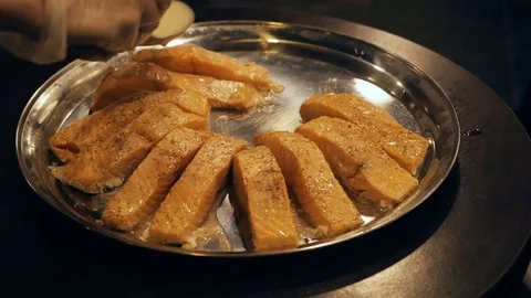 Cook making salmon in a sauce close up. Stock Footage 110903868